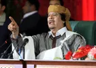 Muammar Gaddafi (1942–2011) spreekt tijdens een televisietoespraak in Tripoli op de 34e verjaardag van de oprichting van het Libische bestuur (2 maart 2011), waarin hij het staatsbestel en de macht van het volk benadrukt.