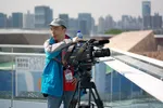 A camera operator on the roof of the Swedish pavilion at the 2010 World Expo in Shanghai.