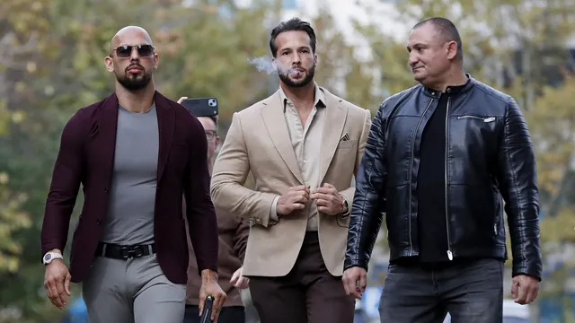 epaselect epa10955927 Former professional kickboxer and social media influencer Andrew Tate (L), followed by his brother Tristan (C), arrive at the court for a hearing on the extension of house arrest, held at the Bucharest Court, in Bucharest, Romania, 03 November 2023. Andrew Tate and his brother Tristan were arrested on 29 December 2022, as a result of the DIICOT (Directorate for Investigating Organized Crime and Terrorism) inquiry on charges of human trafficking and intention to form an organized crime group. Romanian police stated that the two brothers and their associates coerced victims for creating a paid pornography service for social media platforms. On 31 March 2023, Tate brothers and their associates were moved from police custody to house arrest with immediate effect. The court will also consider on 03 November the issue regarding insurance measures on imposed seized assets, as Tate brothers want their seized goods back. The trial itself has not started yet, despite almost a year has passed since the beginning of the investigations in the Tate case. EPA/Robert Ghement