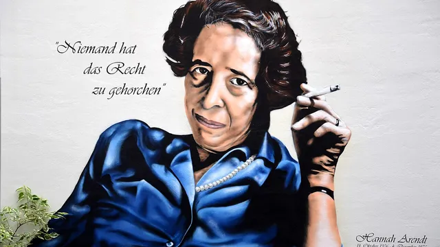 Portrait of the German-Jewish historian and political philosopher Hannah Arendt on a wall in the courtyard of her birthplace at Lindener Marktplatz 2, on the corner of Falkenstraße, in the district of Linden-Mitte. The picture was reproduced from a photograph by Käthe Fürst (Ramat Ha Sharon, Israel) and shows the famous portrait of the philosopher with a cigarette and her famous saying "Nobody has the right to obey". The artwork is a commissioned work by the Hanoverian graffiti artist Patrik Wolters aka BeneR1 in August 2014 in teamwork with Kevin Lasner aka koarts
