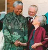South African President Nelson Mandela shakes hands with Bertie Verwoerd, the 94-year-old widow of late apartheid architect and prime minister Hendriek French Verwoerd, in Orania, South Africa, 15 August, a whites-only settlement founded in 1991. Mandela said the purpose of his visit is "to unite South Africa where we cease to think in terms of colour."