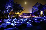 LOS ANGELES, CA - JULY 27:  Listeners sit and lie on fold away loungers as they attend the first outdoor performance of German composer Max Richter's 'SLEEP' in Grand Park, as the moon shines above, on July 27, 2018 in Los Angeles, California. The 8-hour overnight perfomance, mixing classical and electronic music, invites the audience to fall asleep and concludes around sunrise.  (Photo by Mario Tama/Getty Images)