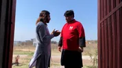 Mudassar interviewing a man about hair