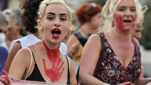 Women demonstrate following reports on the third femicide in the last 48 hours in the country, rising the number to 15 women killed by their husbands or boyfriends in the last 7 months, in central Athens on August 2, 2022. Protesters demand immediate actions for protection of the women reporting an abuse and better judiciary system.
