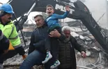 Eight-year-old Yigit Cakmak (C) reacts after being rescued from the site of a collapsed building, some 52 hours after a major earthquake, in Hatay, Turkey, 08 February 2023. More than 7,000 people have died and thousands more injured after two major earthquakes struck southern Turkey and northern Syria on 06 February. Authorities fear the death toll will keep climbing as rescuers look for survivors across the region. EPA/ERDEM SAHIN