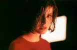 fotomodel Valentine (Irène Jacob) in Trois Couleurs: Rouge