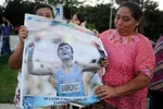 Fans of Guatemala's first Olympic medallist, Erick Barrondo (pictured C), gather ahead his return to Guatemala City on August 13, 2012 upon the completion of the 2012 London Olympic Games. The 21-year-old Barrondo won Guatemala's first ever medal in Olympic history with silver in the men's 20 kilometres walk on August 4. AFP PHOTO / Johan ORDONEZ
