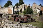 epa03850279 Two burned cars are seen in Oradour-sur-Glane, a site of a massacre by German Waffen SS troops during World War II, where French President Francois Hollande and German President Joachim Gauck will pay tribute later today, in France, 04 September 2013. Today will be the first visit by a German leader to the village where Nazi forces killed 642 people, mostly women and children, on June 10, 1944, in an apparent bid to crush local support for the French Resistance. Only six inhabitants survived the attack. EPA/YOAN VALAT