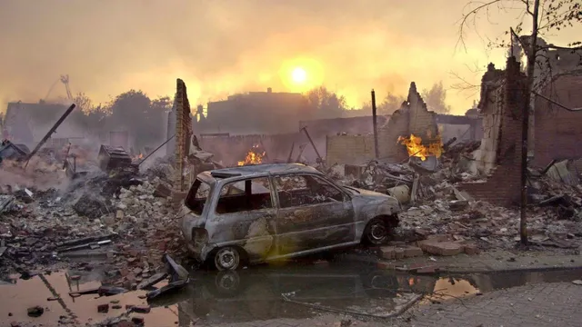 epa01321866 (FILES) A file picture dated 13 May 2000 shows the aftermath of an explosion and fire in a fireworks factory in Enschede's Roombeek neighbourhood, the Netherlands. The explosion swept away 43 hectares of the city. Dutch Queen Beatrix will tour the rebuild neighbourhood 22 April 2008 and open a new cultural centre center "het Rozendaal" in the neighbourhood.  EPA/OLIVER STRATMANN